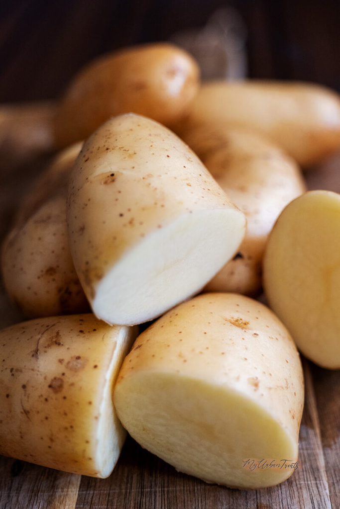 Cleaned russet potatoes ready to be grated for tater tots